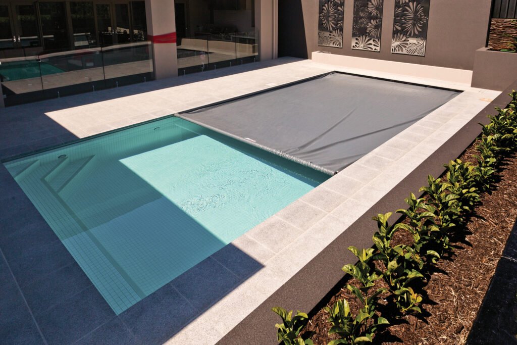 swimming pool with cover partially closed